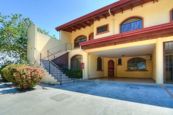 Front of condo with garage