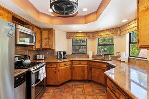 Fridge, microwave, oven, stovetop - Big Bear Bungalow by Destination Big Bear : Hot Tub! Fenced Yard! Internet! Gas BBQ! Luxury! Family Friendly! Wood Burning Fireplace! (Big Bear Lake)