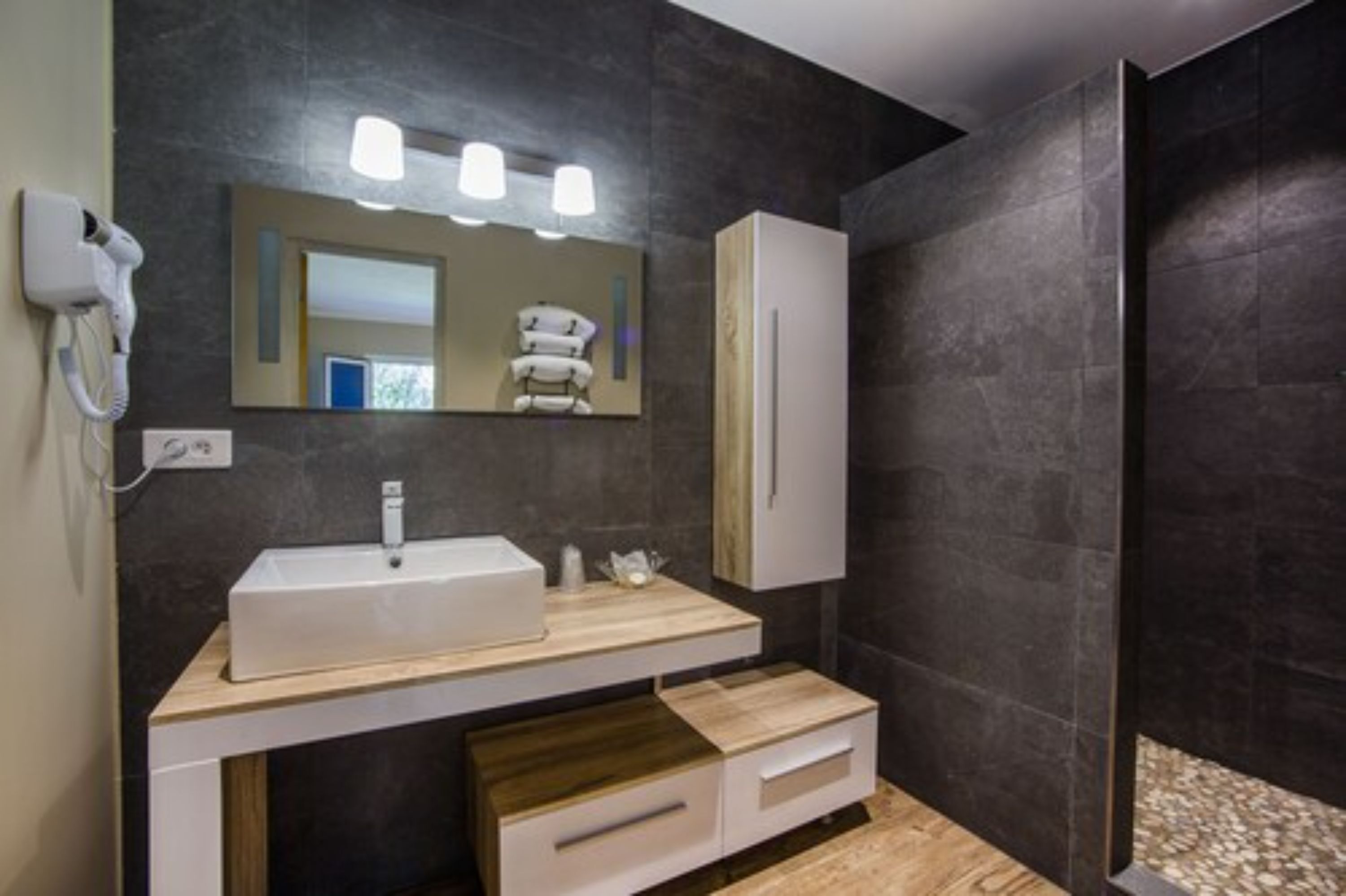 quadruple room | bathroom | shower, rainfall showerhead, free toiletries, hair dryer