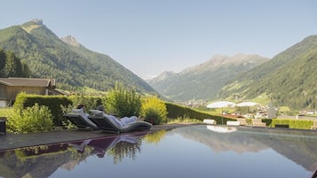 Outdoor pool, an infinity pool, sun loungers