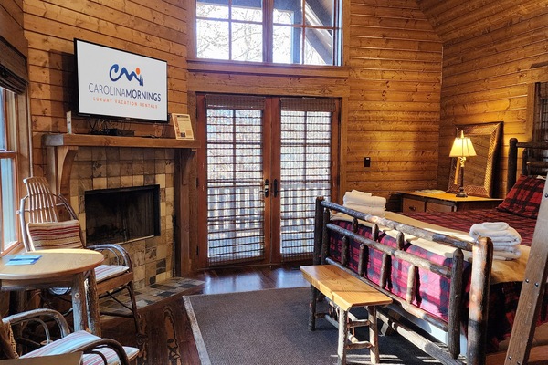 Main Level Living Area w/ Wood Burning Fireplace & King Bed