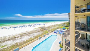 A hotel with a pool, beach view, and multiple balconies. - Three Bedroom at Phoenix 5 with Reserved Parking (Orange Beach)