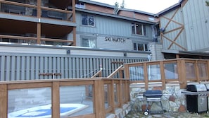 A multi-story building with a sign reading "SKI WATCH".