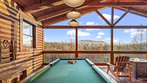 A pool table in a log cabin with a view of a forest and mountains. - Love Me Tender: Amazing Views, Romantic, Fire Pit (Gatlinburg)