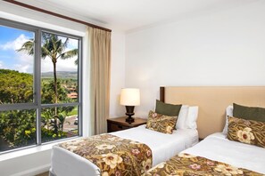 A hotel room with two beds, a window with a view of palm trees and a road, and a nightstand with a lamp. - Honua Kai Konea | Ocean View 2 BR | Remodeled Corner Villa | HKK-334 by KBM (Lahaina)