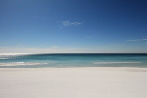 A beach with clear skies and calm waters.