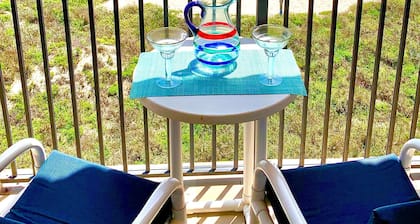 ESCAPE to Bright Top Floor Beachfront Condo in Perfect Location