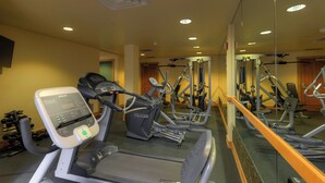 A gym with treadmills, elliptical machines, and weightlifting equipment. - Private Balcony with Gorgeous Mountain Views, Easy Access to Everything! (Keystone)