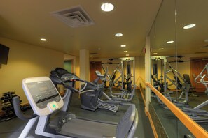 A gym with treadmills, elliptical machines, and weightlifting equipment. - Private Balcony with Gorgeous Mountain Views, Easy Access to Everything! (Keystone)