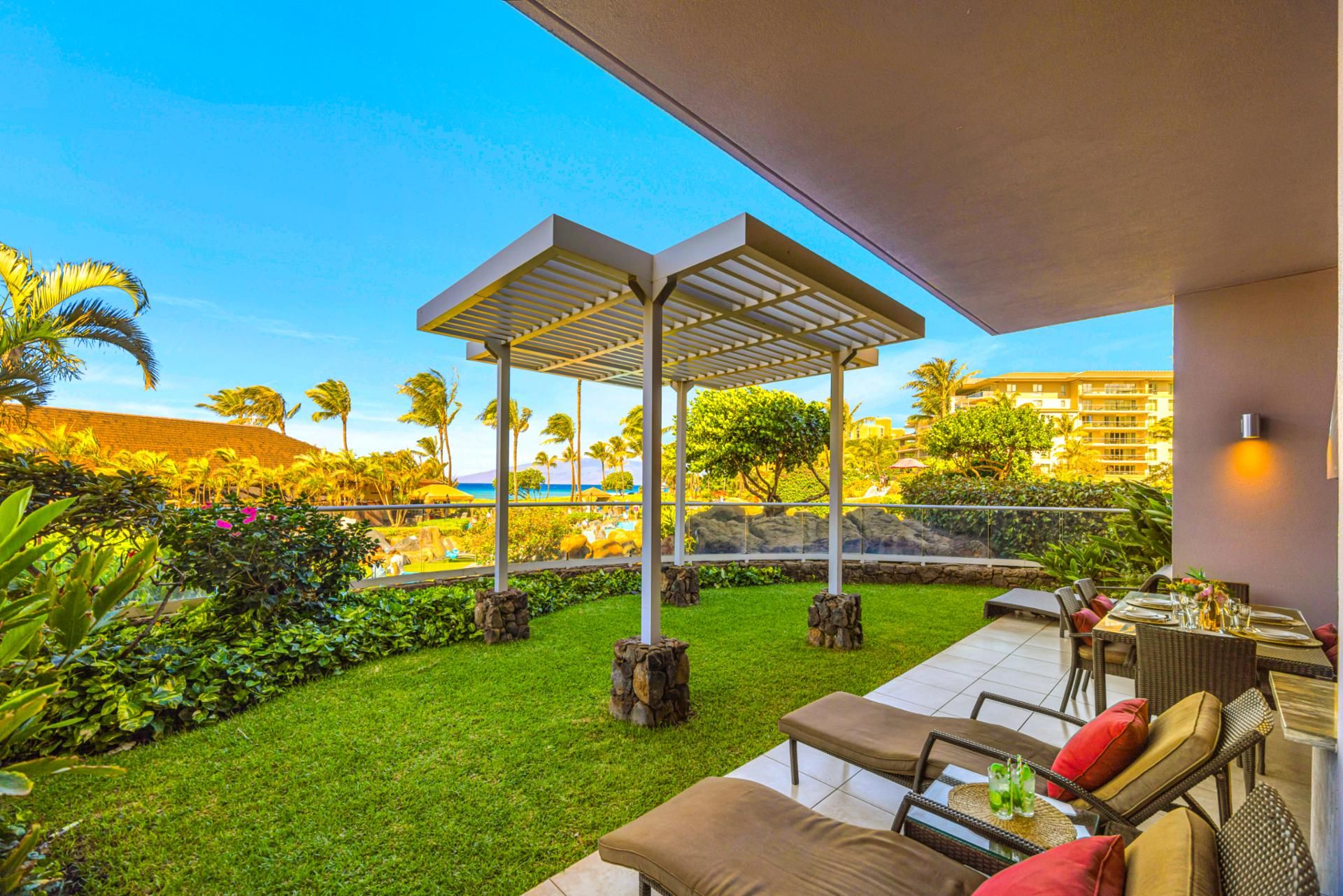 Outdoor BBQ kitchen at Honua Kai HKH-150 — Viking grill, stainless hood, and granite prep counter