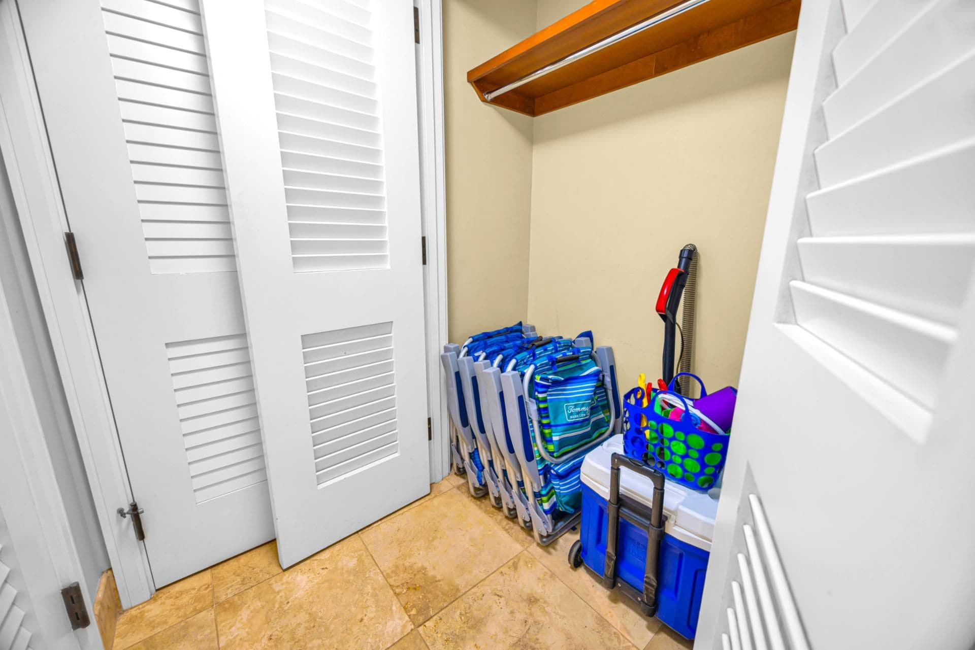 Beach gear closet at Honua Kai Hokulani 150 — complimentary beach chairs, cooler, and beach toys ready to grab for a day at Kaanapali