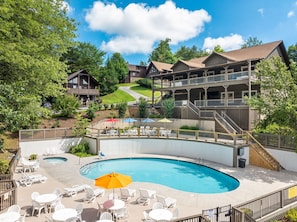 Relax by the pool surrounded by comfortable seating and scenic views.