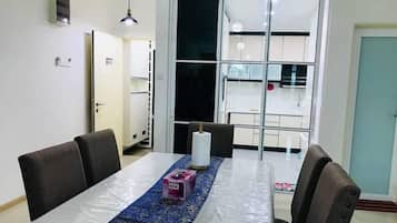Family Apartment, 3 Bedrooms, City View | In-room dining