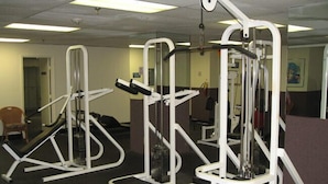 A gym with various exercise machines, including a treadmill, leg press, and chest press. - Hollywood Beach Resort - Renovated Large Studio (Hollywood)