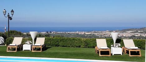 Seasonal outdoor pool, pool loungers