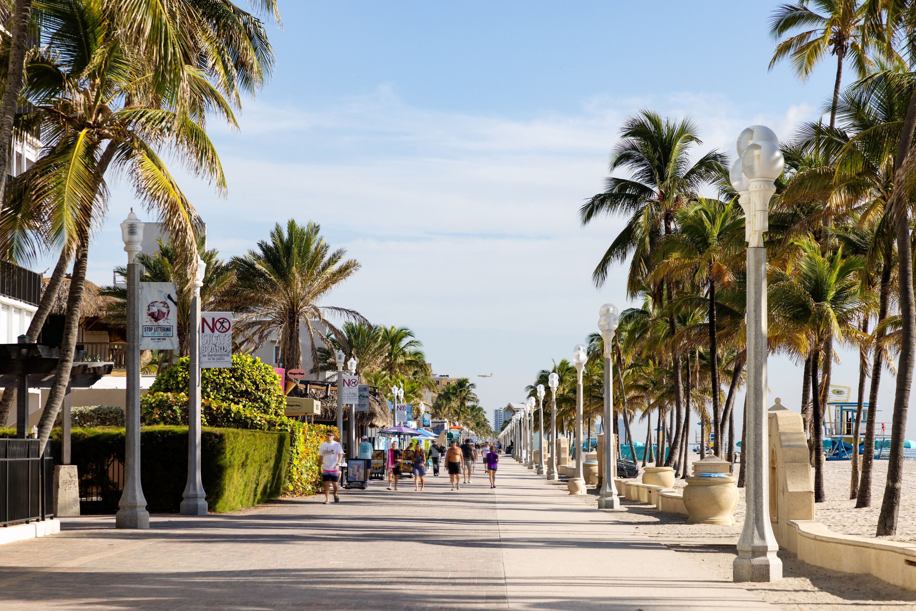 on the beach, white sand, beach cabanas, sun-loungers