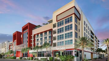 QUORE hotel features a modern architectural design with multiple floors, balconies, and large windows.