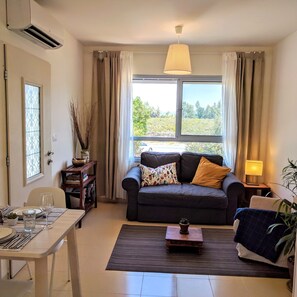 Premium Apartment, 1 Bedroom, Jetted Tub, Mountain View | Living area | 48-inch flat-screen TV with cable channels, TV, Netflix - Al Sfat HaBanias (HaGalil HaElyon)