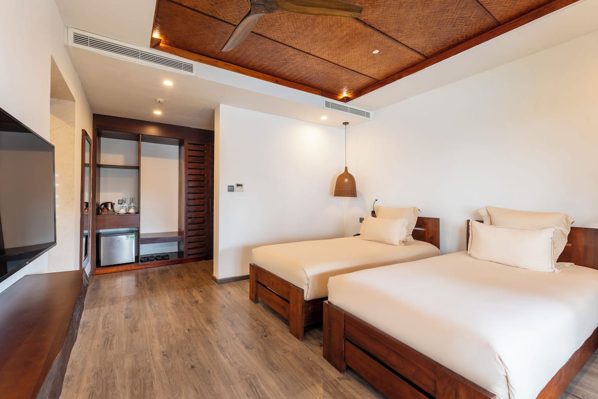 Family Room, Balcony, Pool View | Pillow-top beds, minibar, in-room safe, individually decorated