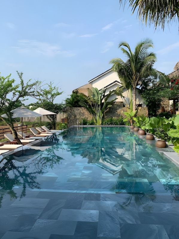Outdoor pool, open 7:30 AM to 10 PM, pool umbrellas, pool loungers