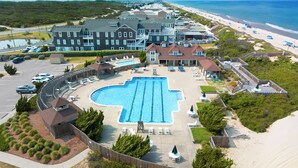 A resort with a large swimming pool, beach access, and multiple buildings. - Always Summer: Private Pool, Spa, Club Access (Corolla)
