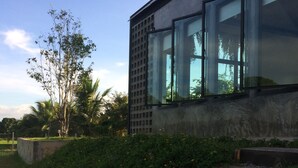 A modern building with large windows and a concrete facade.