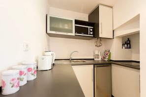 Fridge, microwave, stovetop, coffee/tea maker