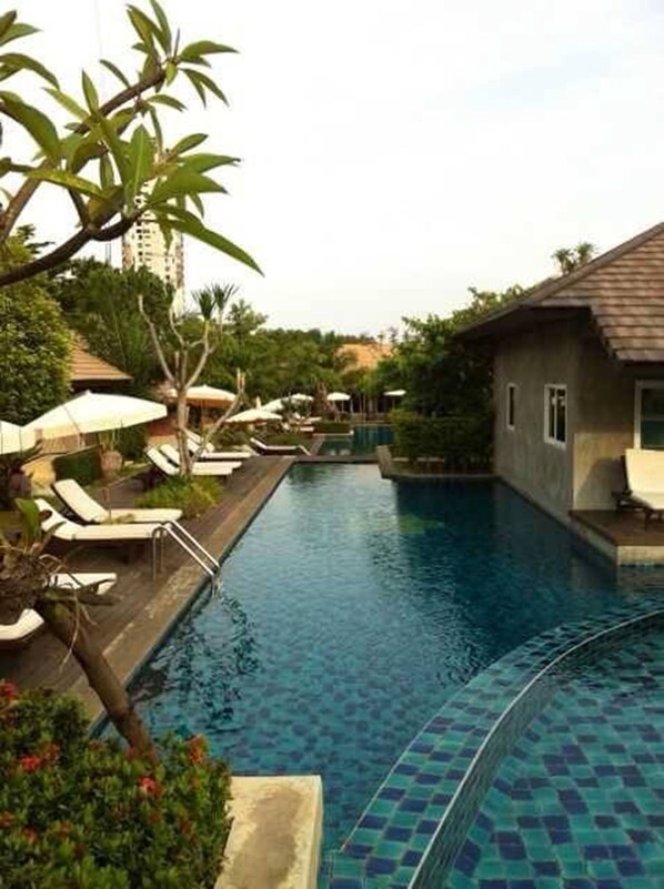 Outdoor pool, open 6 AM to 10 PM, pool umbrellas, pool loungers