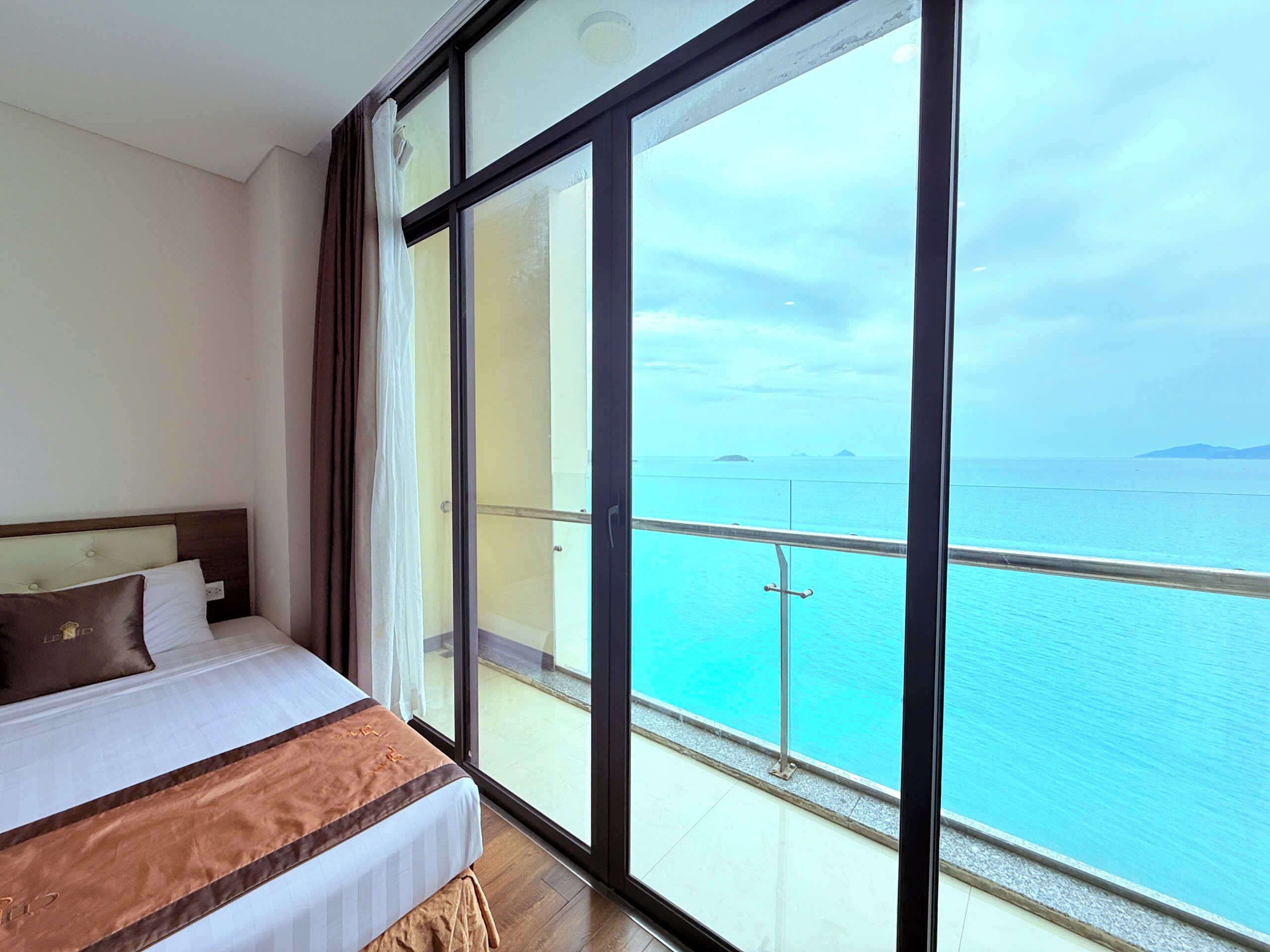 Deluxe Quadruple Room, 1 Bedroom, Sea View | Premium bedding, minibar, in-room safe, desk