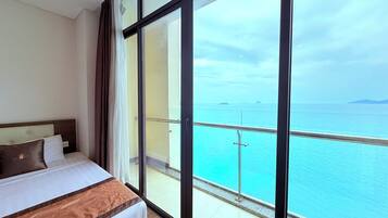Deluxe Quadruple Room, 1 Bedroom, Sea View | Premium bedding, minibar, in-room safe, desk