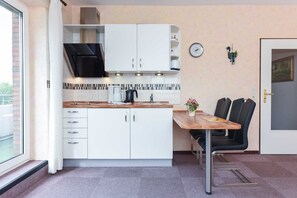 Fridge, coffee/tea maker, electric kettle, toaster