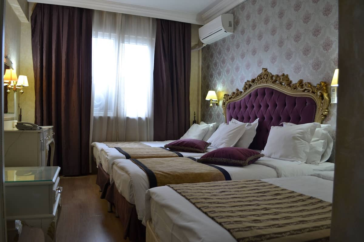 Family Quadruple Room, Multiple Beds | Minibar, in-room safe, desk, cribs (surcharge)