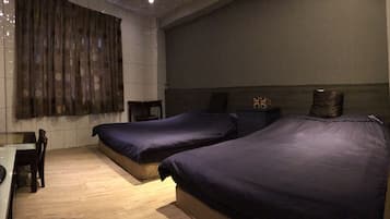Standard Quadruple Room | Individually furnished, desk, laptop workspace, blackout curtains