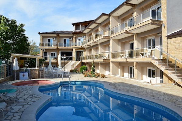 Outdoor pool, pool umbrellas, pool loungers