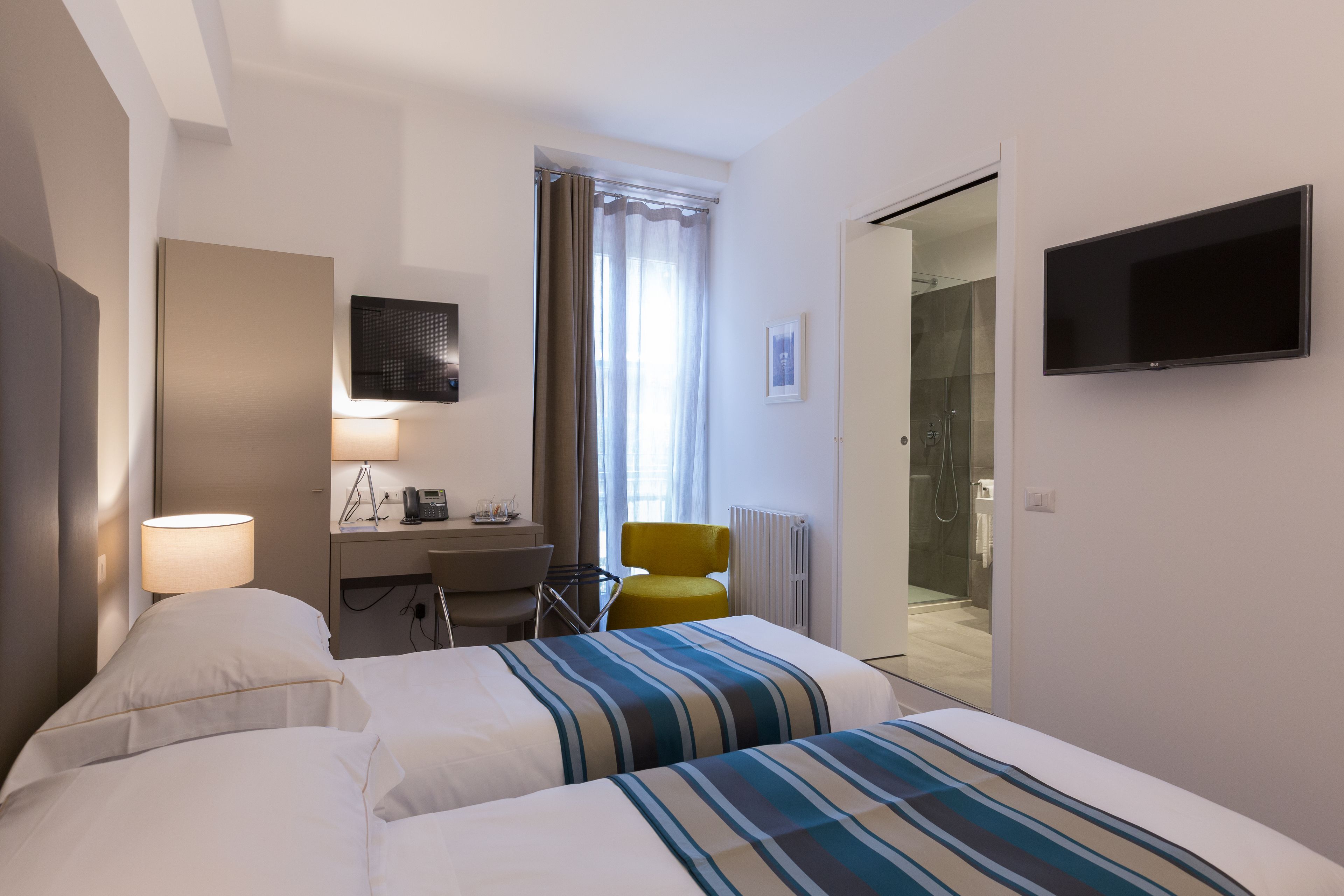 premium bedding, down duvets, minibar, in-room safe