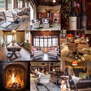 A hotel lobby with a large wooden table, comfortable seating, a fireplace, and a wine bottle. - Huize Hölterhof (Enschede)