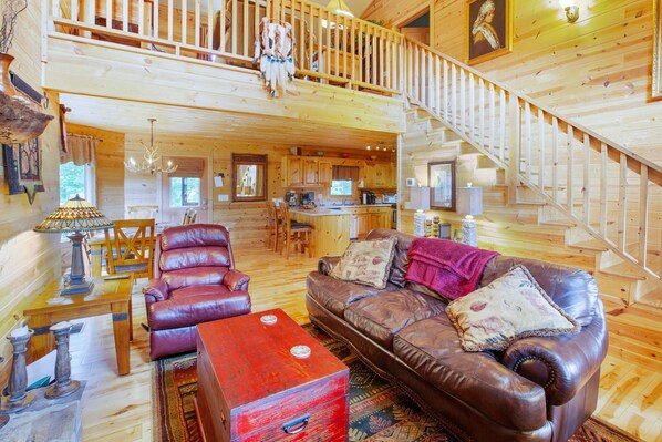 A wooden cabin interior with a living room, kitchen, and staircase. - New Kitchen, EV charging, great reviews
3 levels, privacy2 fireplaces,hottub (Hiawassee)