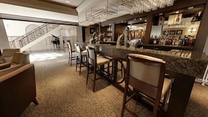 A bar area with a marble countertop, bar stools, and a staircase in the background. - Dumfries Arms Hotel (Cumnock)