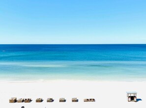 On the beach, sun-loungers