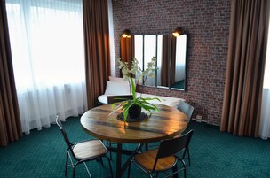 Family Quadruple Room | Living area | 32-inch flat-screen TV with cable channels, TV