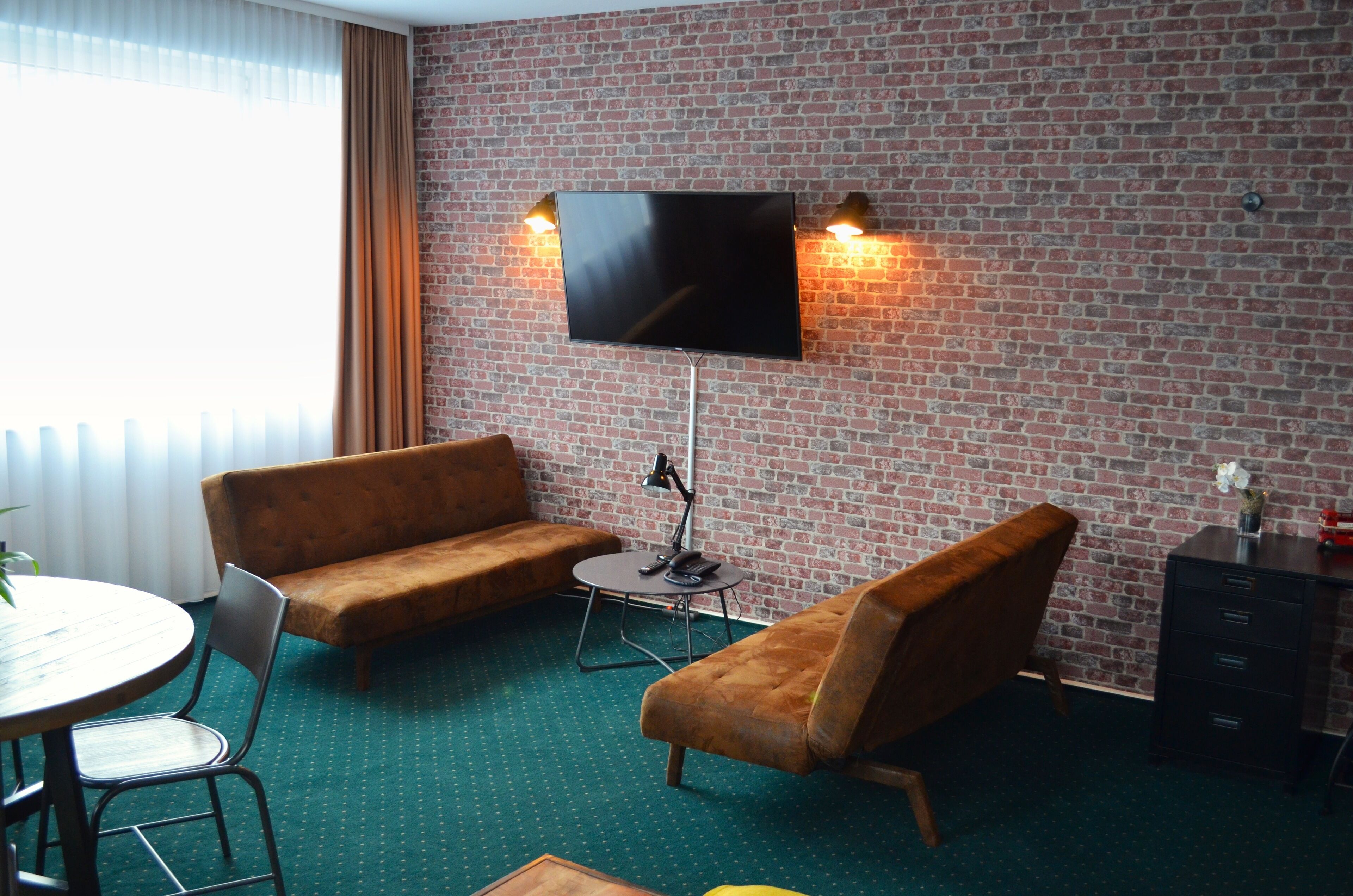 family quadruple room | living area | 32-inch flat-screen tv with cable channels, tv