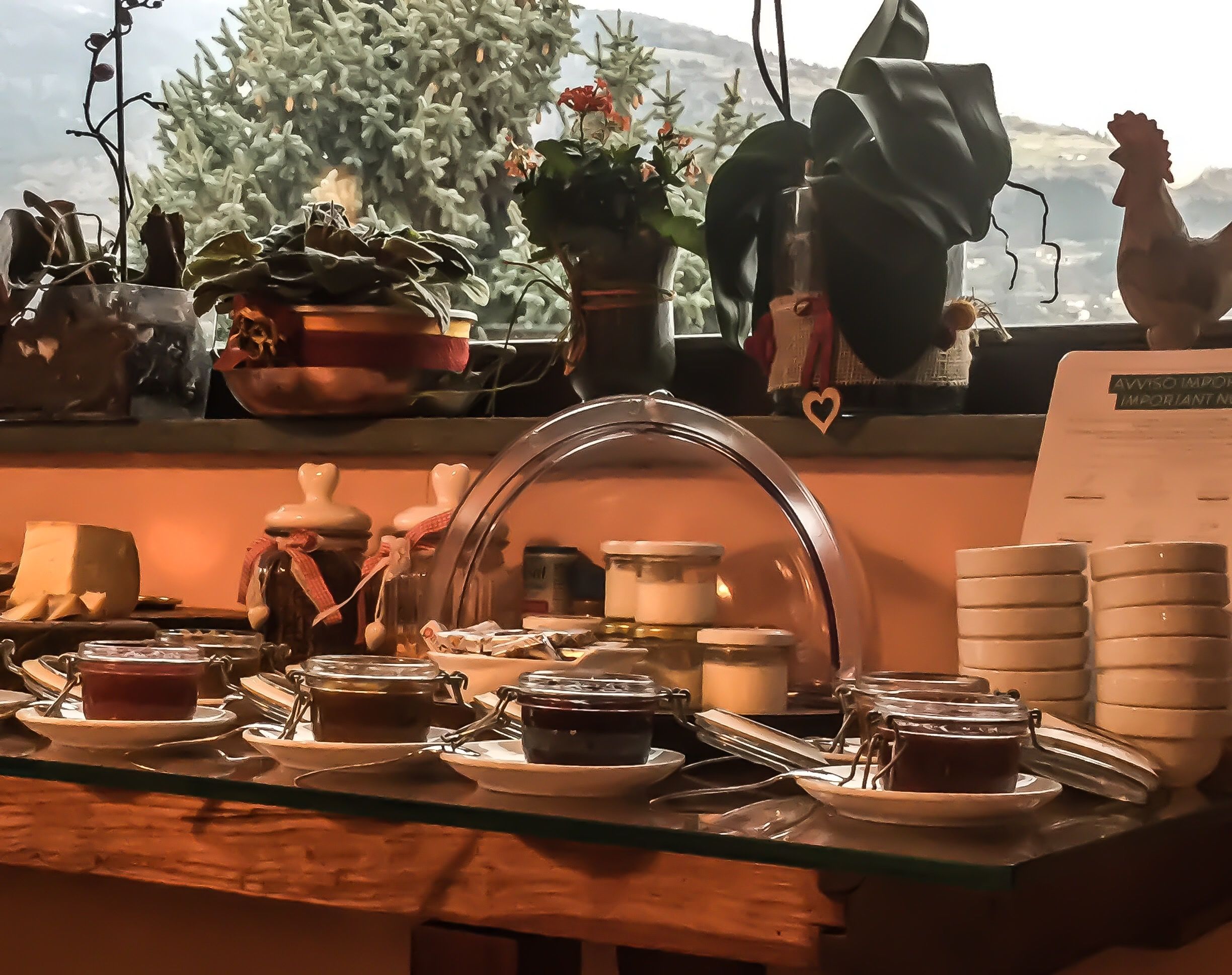 A buffet setup with various food items and condiments on display.