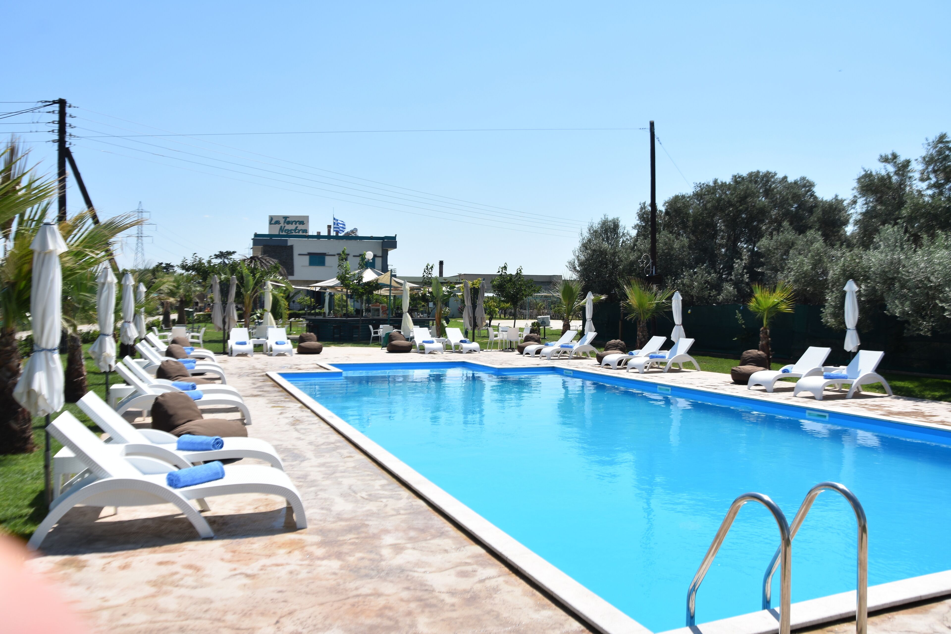 outdoor pool, open 10:30 am to 8:00 pm, pool umbrellas, pool loungers