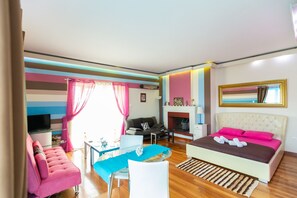 Apartment, Sea View (Triple Studio) | Living area | Plasma TV - La Terra Nostra (Corinth)