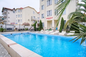 Outdoor pool, open 8:00 AM to 10:00 PM, pool loungers