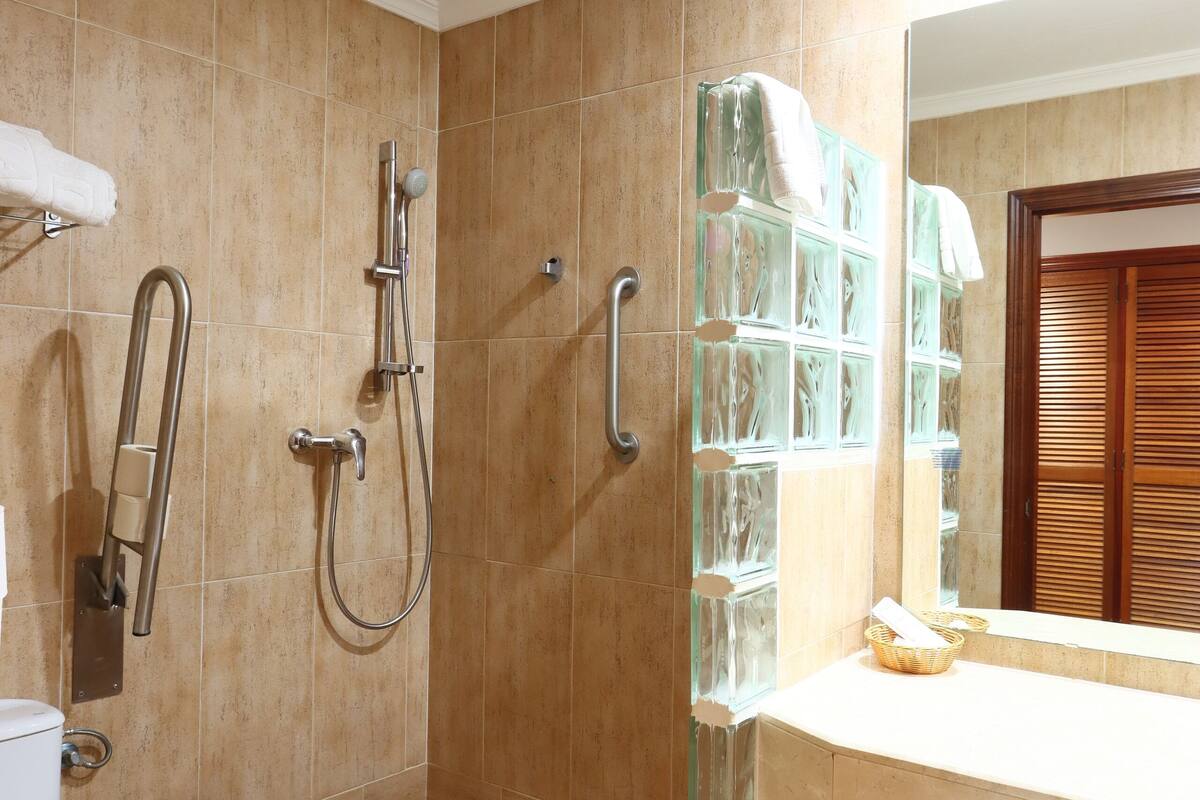 shower, hair dryer, bathrobes, towels