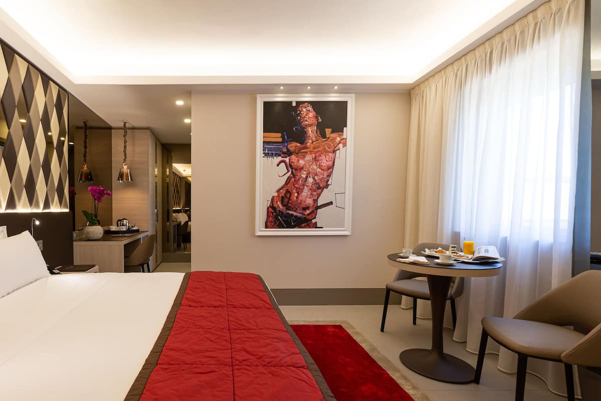 Exclusieve kamer, 1 twee- of 2 eenpersoonsbedden (Sole & Stella) | 1 slaapkamer, luxe beddengoed, donzen dekbedden, een minibar