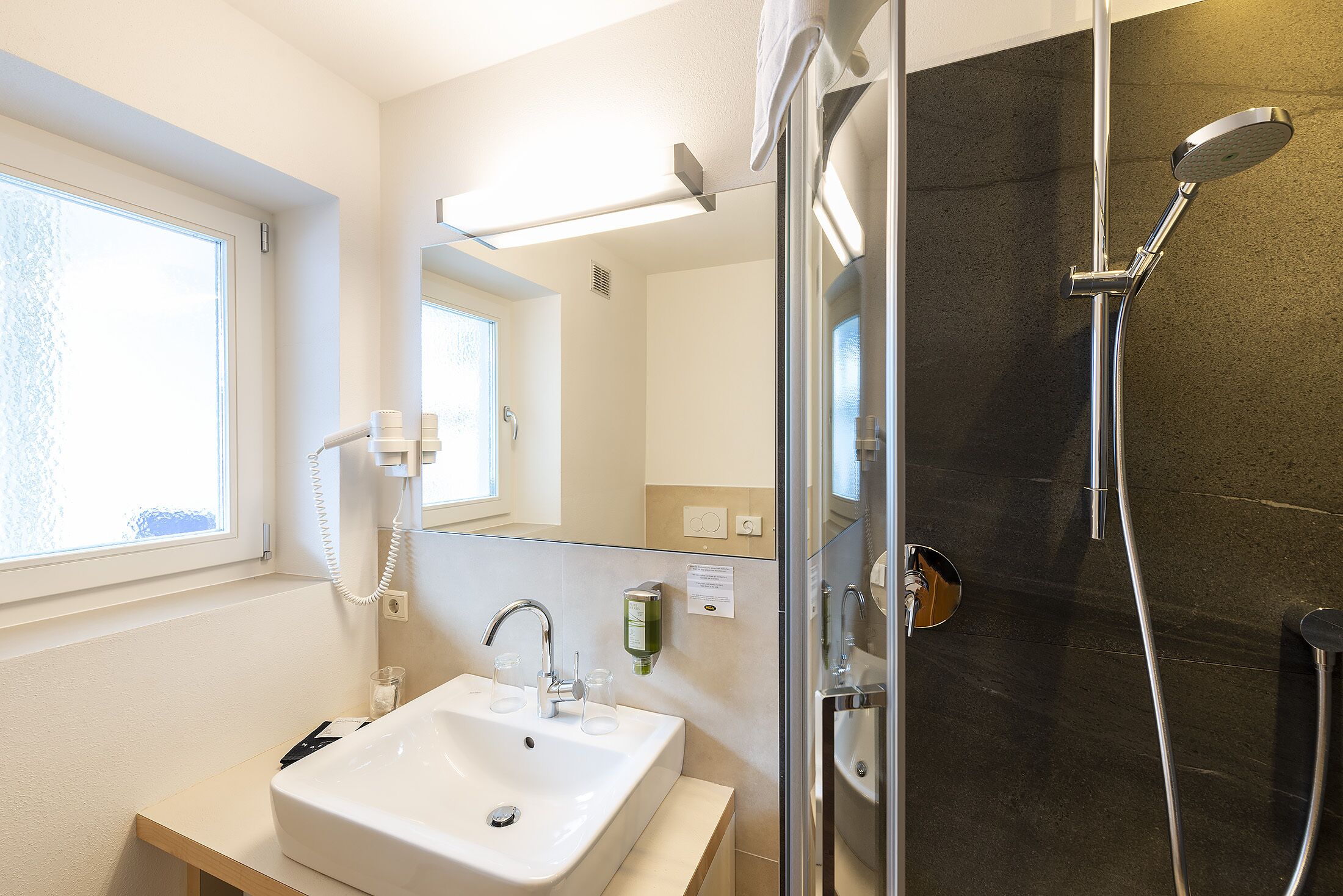 deluxe double room | bathroom | rainfall showerhead, free toiletries, hair dryer, bidet
