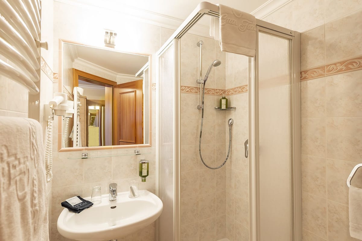 standard single room | bathroom | rainfall showerhead, free toiletries, hair dryer, bidet