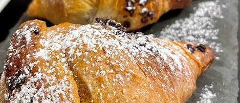 Two pastries on a slate surface.